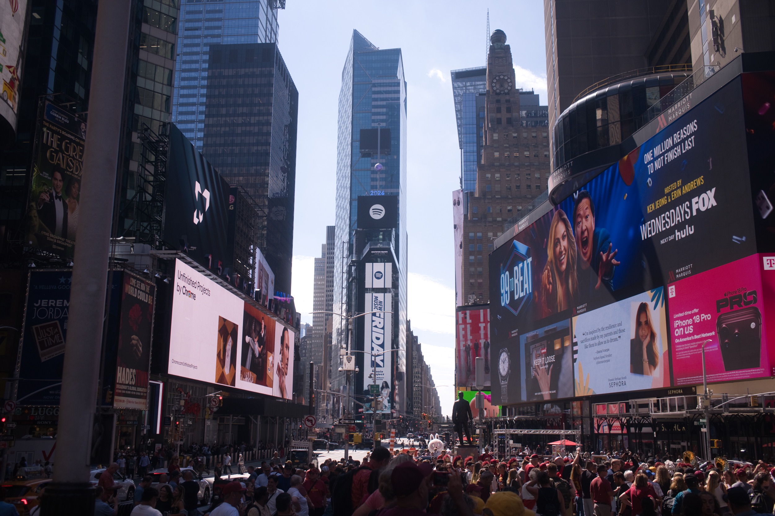 Times Square framed by skyscrapers and illuminated billboards