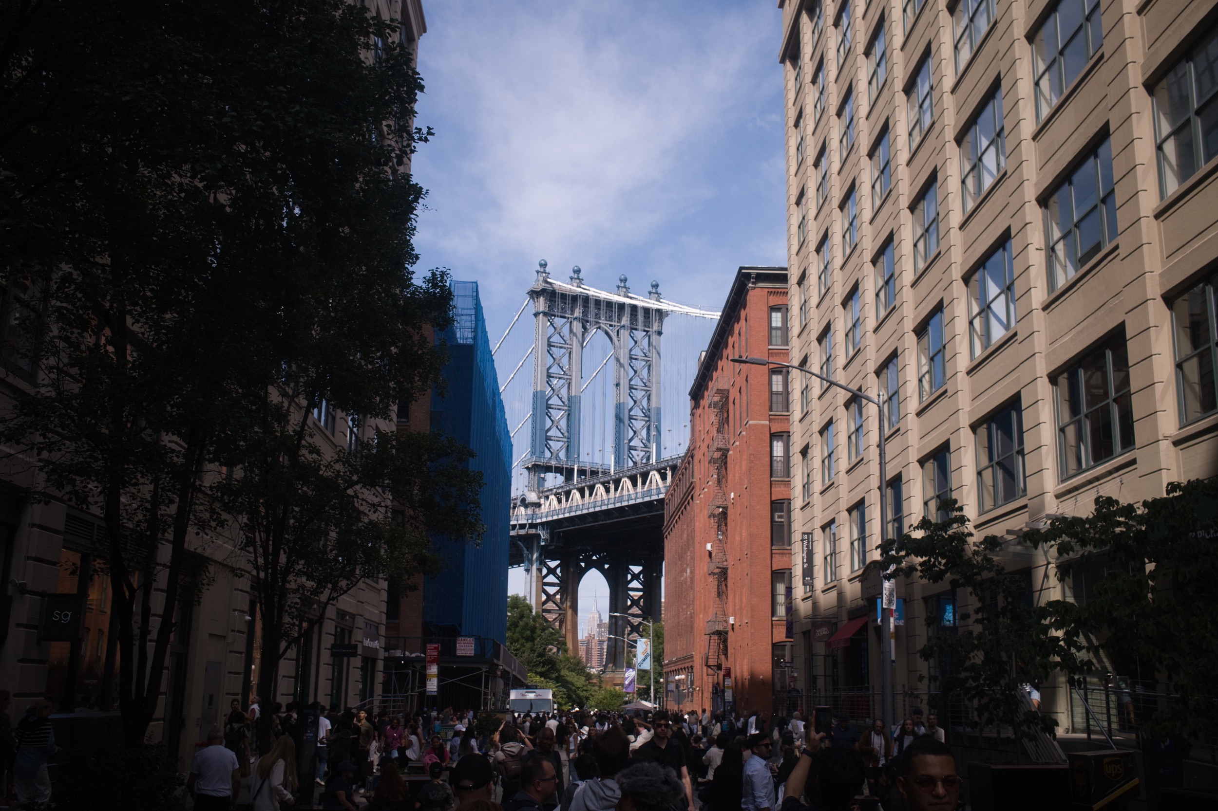 The Manhattan Bridge framed by buildings in Dumbo