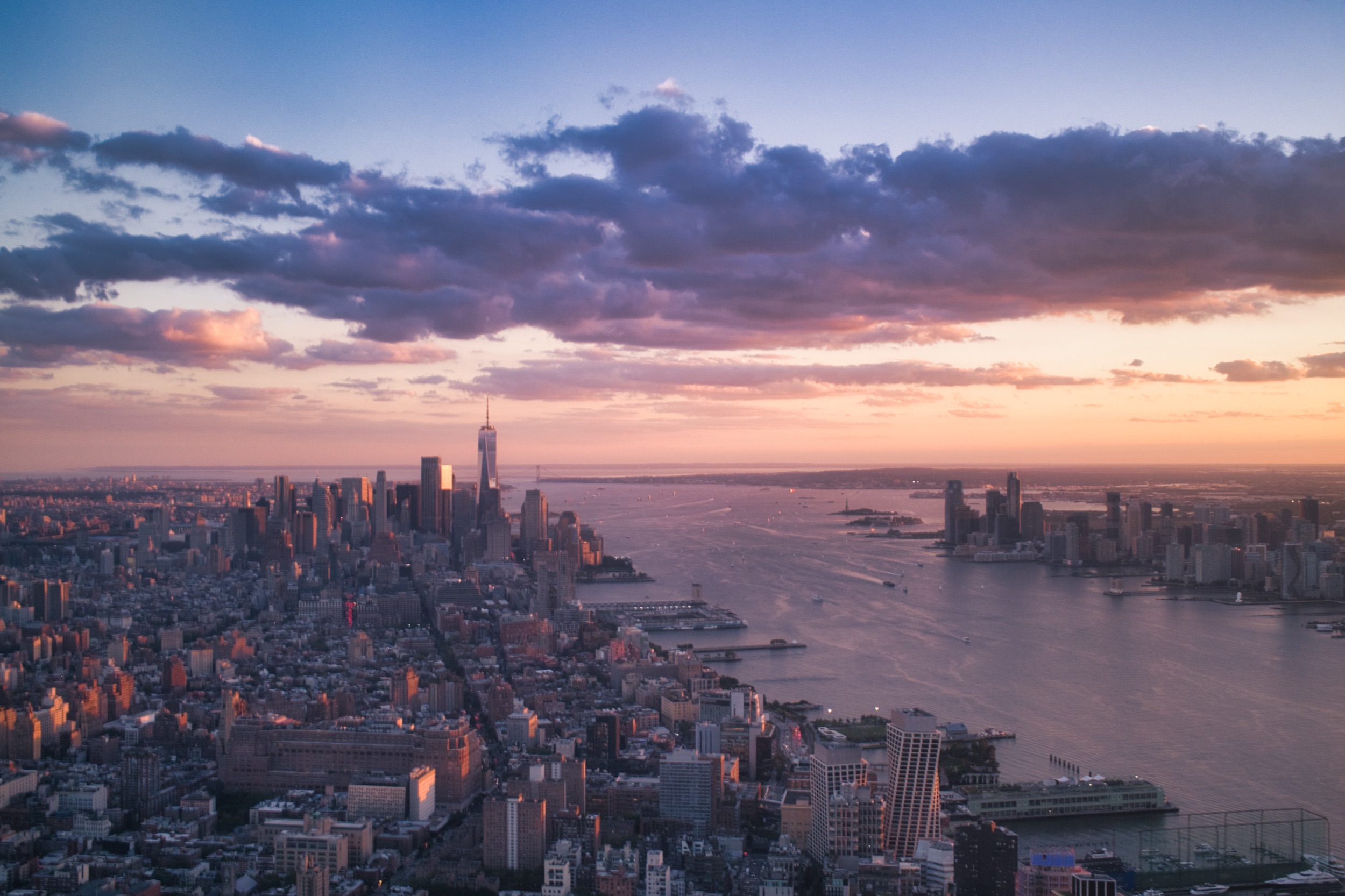 Lower Manhattan and the Hudson River beneath a dramatic sky