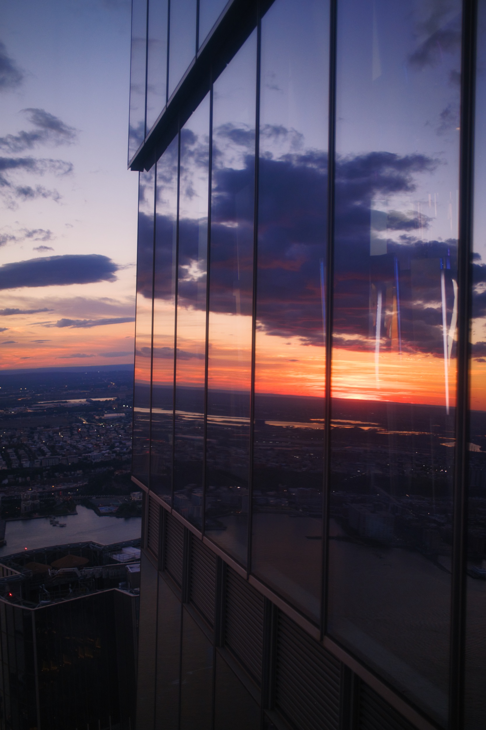 Sunset reflected in the windows of a skyscraper