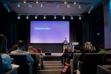 An audience watching Matt present at a conference